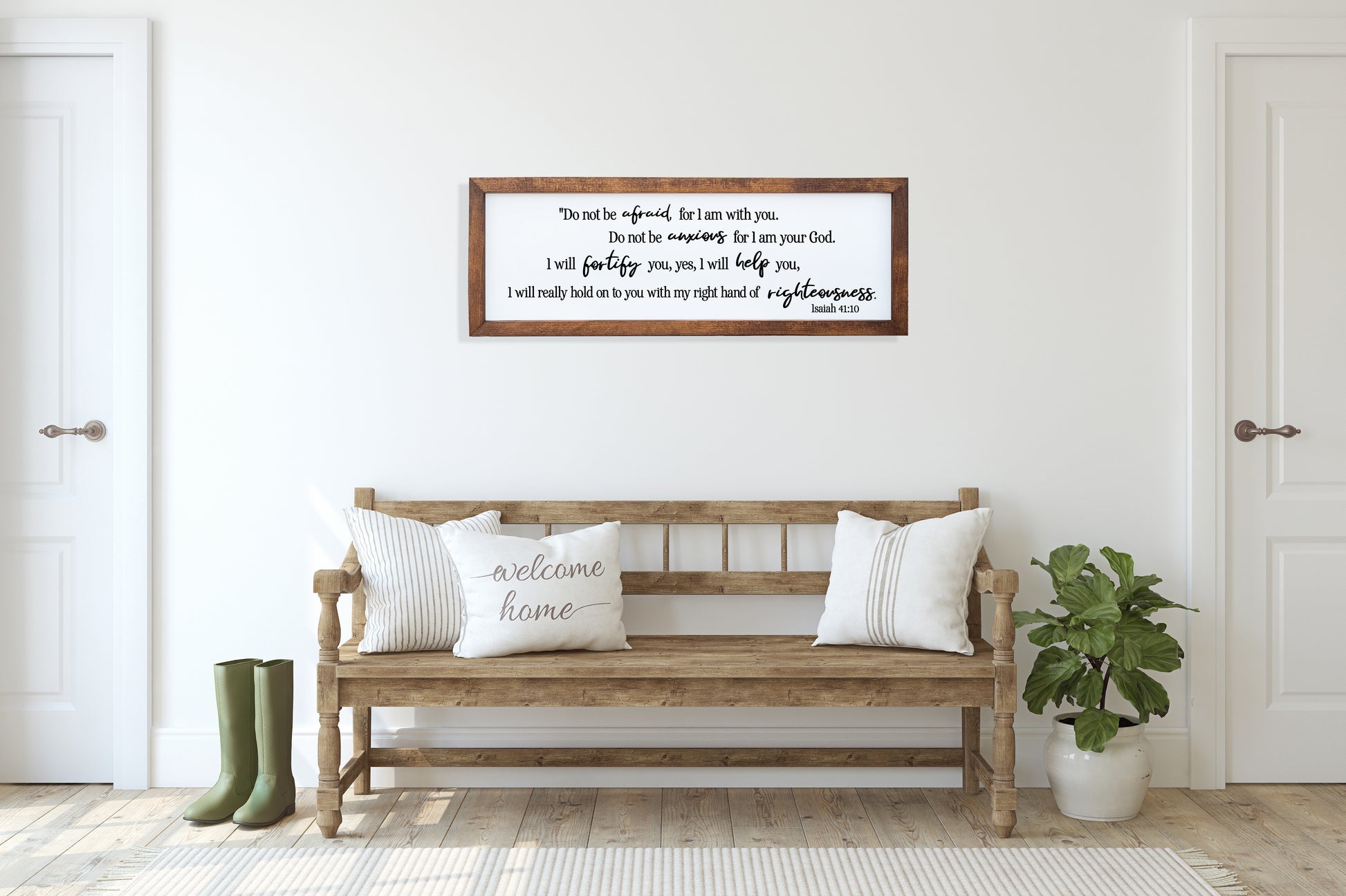 Wooden bench with pillows in a room with a framed quote on the wall.